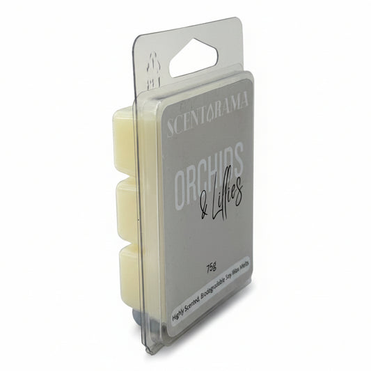 A packaged wax melt product standing upright in a clear plastic clamshell package. The front label reads SCENTARAMA ORCHIDS & LILLIES, and the wax melts inside are a pale creamy yellow.