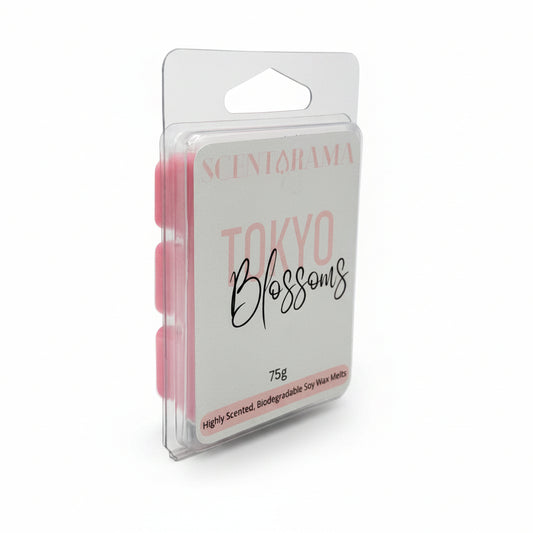 A packaged wax melt product standing upright in a clear plastic clamshell package. The front label reads 'SCENTARAMA' and 'Tokyo Blossoms' in pink and black script, with '75g' near the bottom.