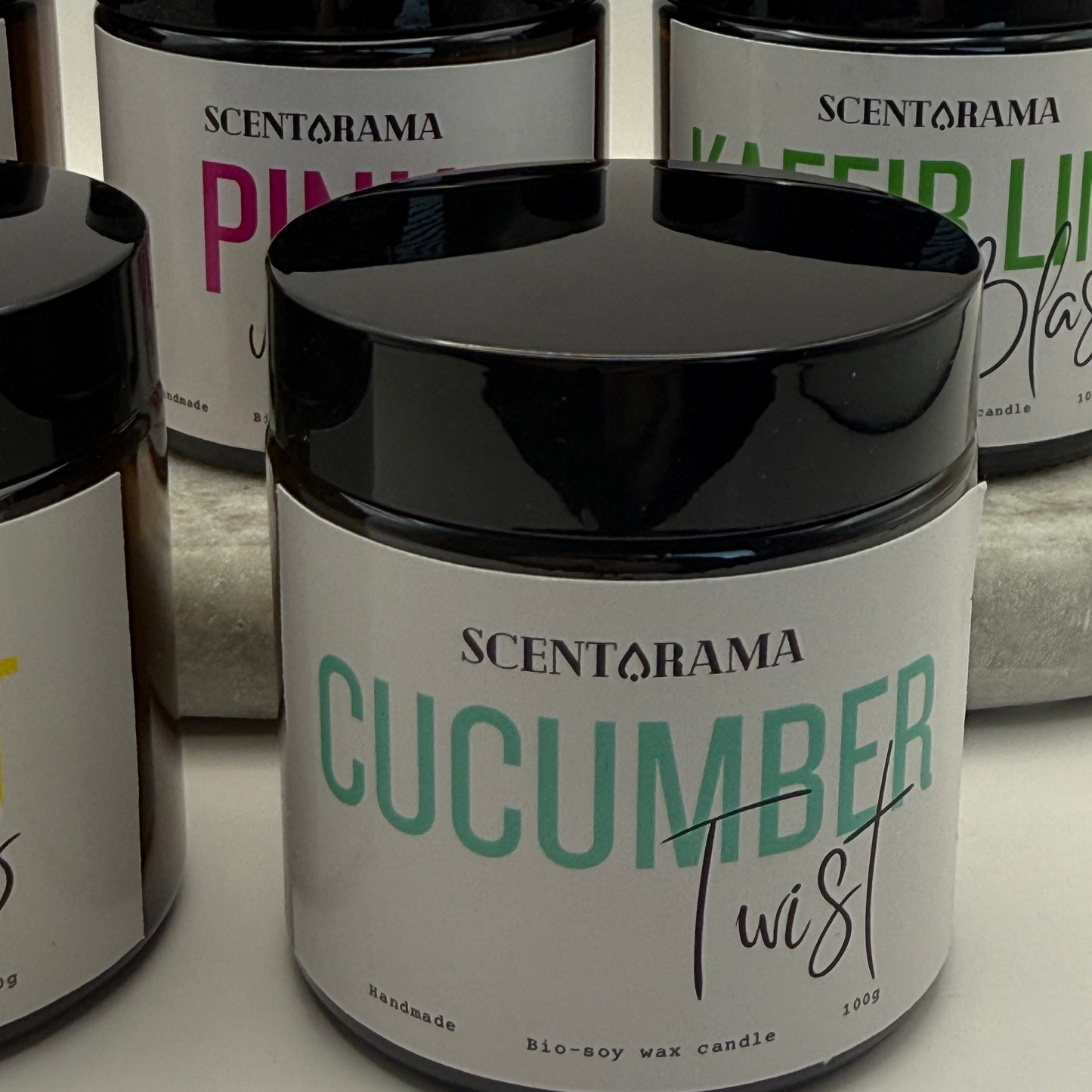Scentarama candles with various scents on a white background