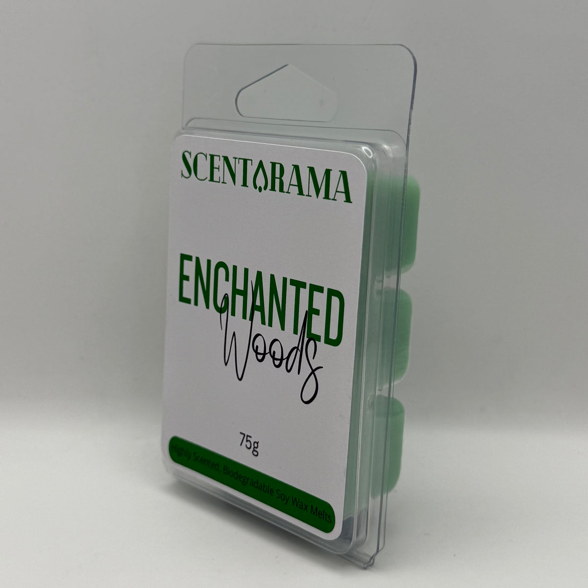 A packaged Scentarama Enchanted Woods wax melt set in a clear plastic clamshell package with a white label and green text, photographed on a light gray background.