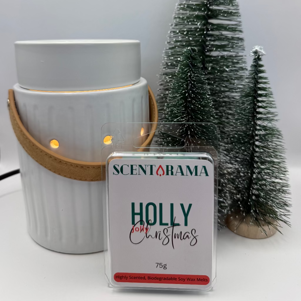 Leather Handle White wax warmer with a 'Holly for Christmas' scented wax melt and small Christmas trees on a white background