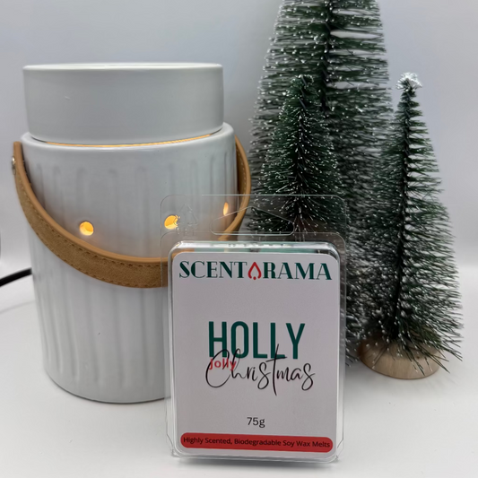 Leather Handle White wax warmer with a 'Holly for Christmas' scented wax melt and small Christmas trees on a white background