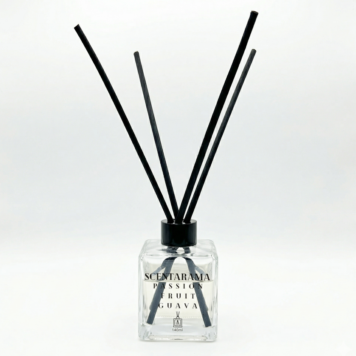 Passionfruit Guava Reed Diffuser with black sticks and clear bottle on a white background