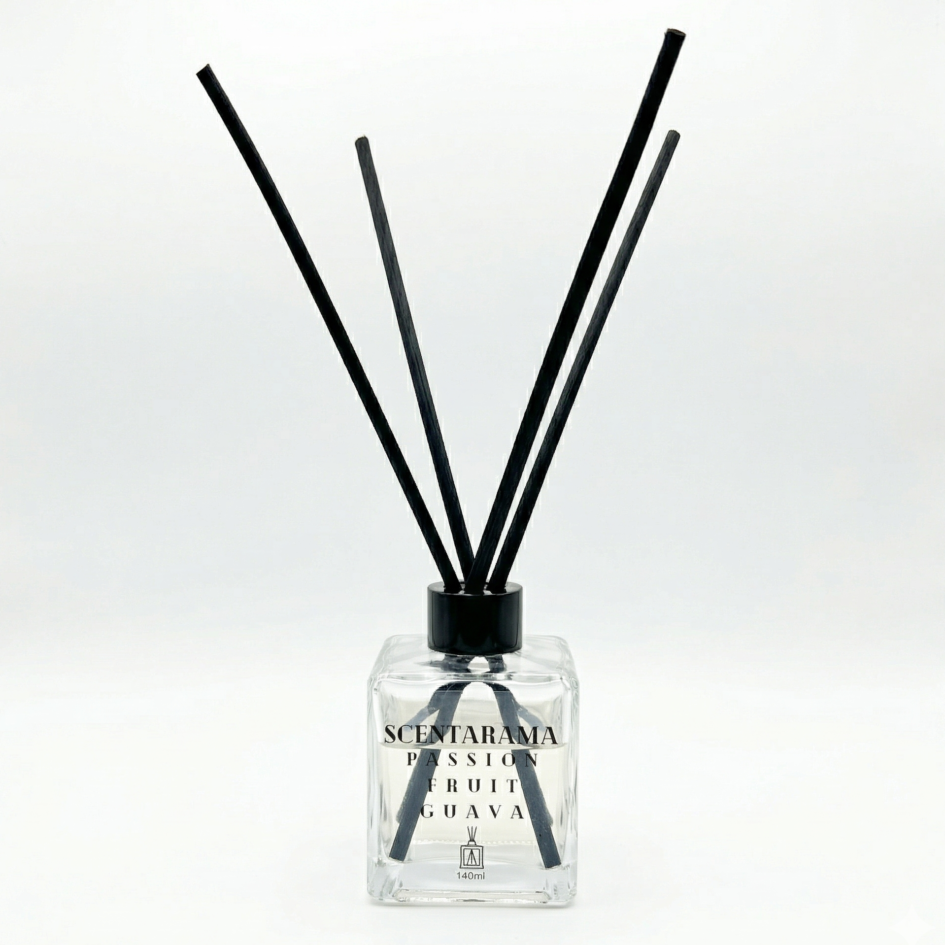 Passionfruit Guava Reed Diffuser with black sticks and clear bottle on a white background