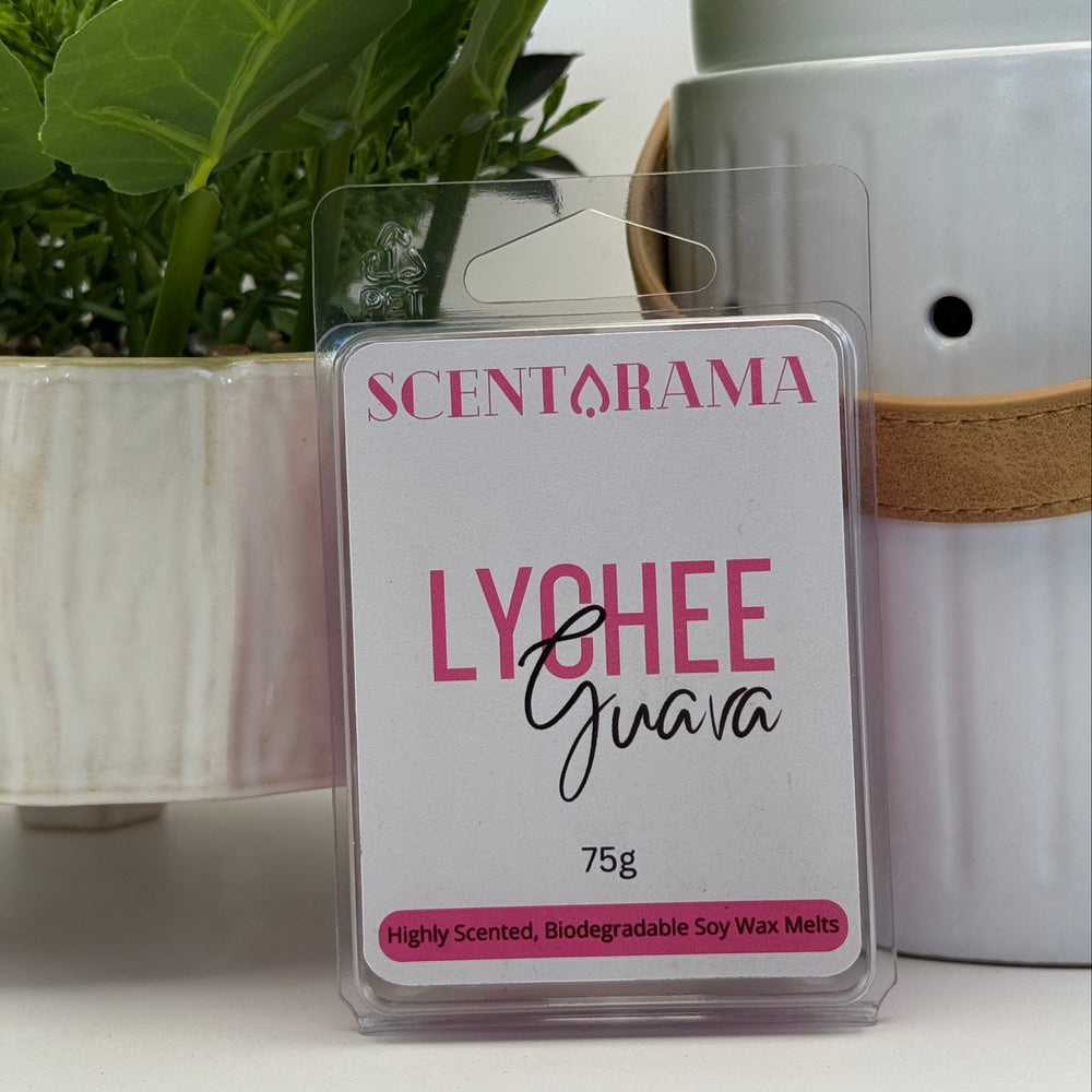 Scentarama Lychee Guava soy wax melts with packaging and plant in the background