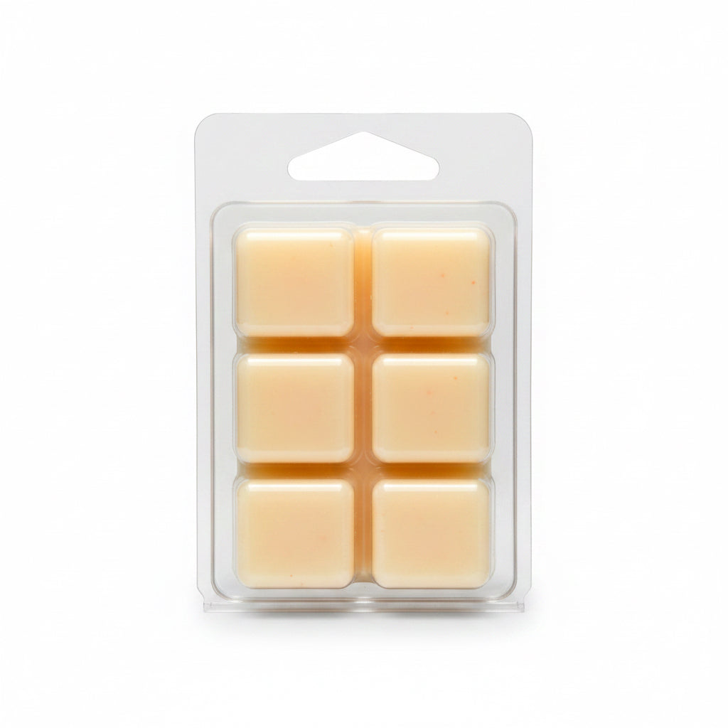 Pack of six peach wax melts in a clear plastic packaging on a light gray background