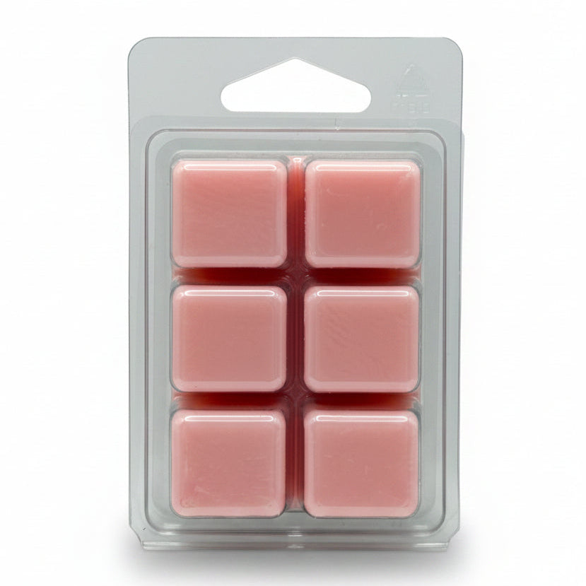 Six pink wax melts in a clear plastic clamshell package with a hanger tab, set against a plain light white background.