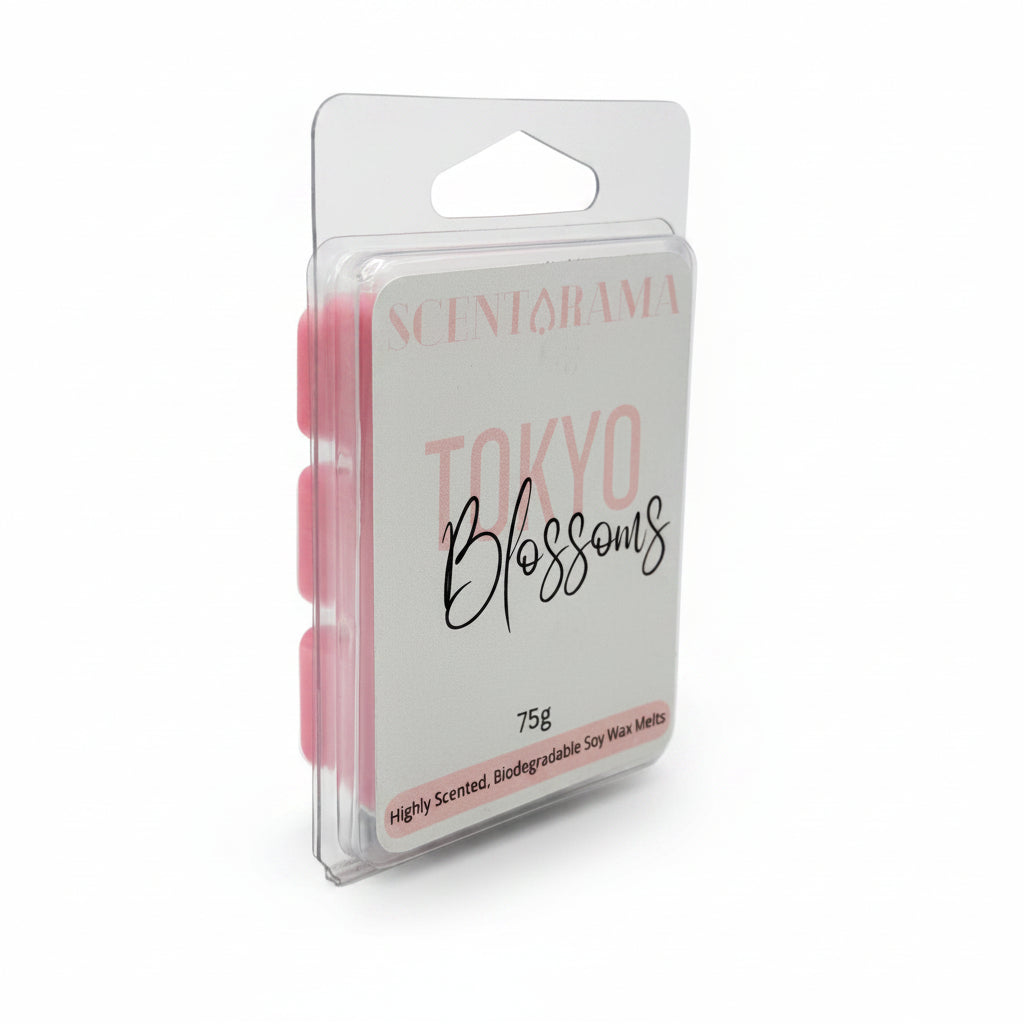 A packaged wax melt product standing upright in a clear plastic clamshell package. The front label reads 'SCENTARAMA' and 'Tokyo Blossoms' in pink and black script, with '75g' near the bottom.