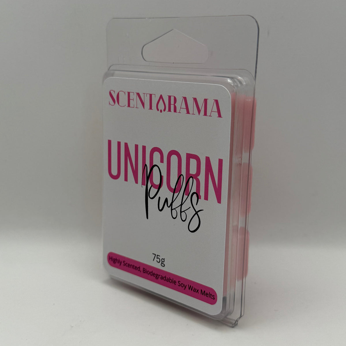 A package of Scentarama Unicorn Puffs wax melts in a clear plastic clamshell container with a white and pink label, set against a plain light gray background.