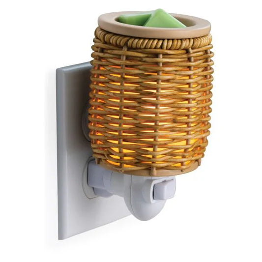 Wicker-style  Candle Warmers Australia wall plug night light emitting warm glow.